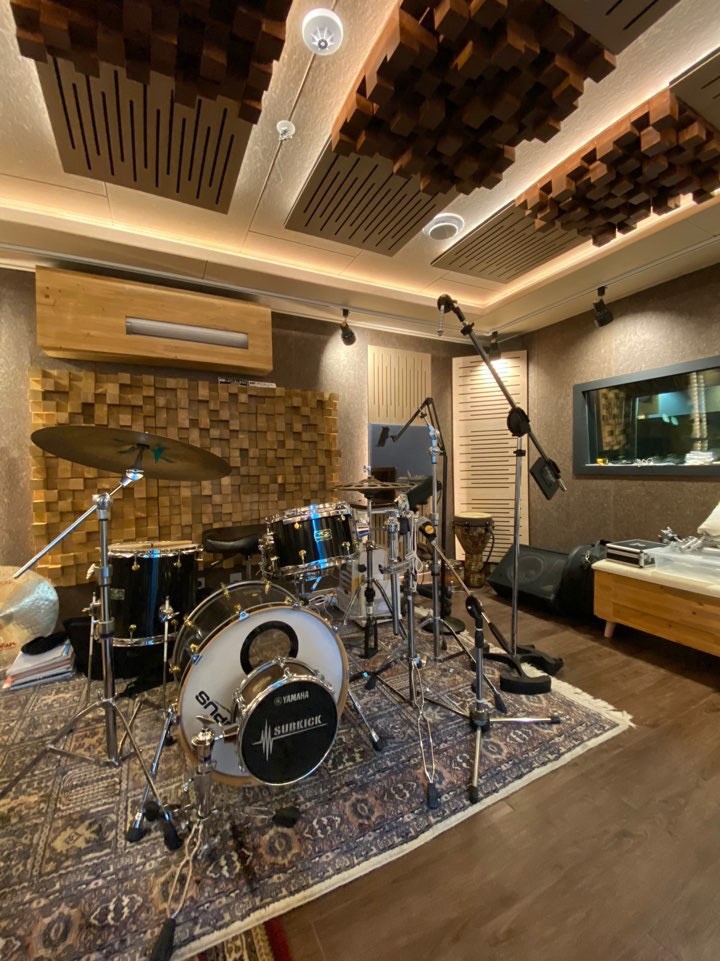 SORIGIO drum studio with wood ceiling and wall treatment